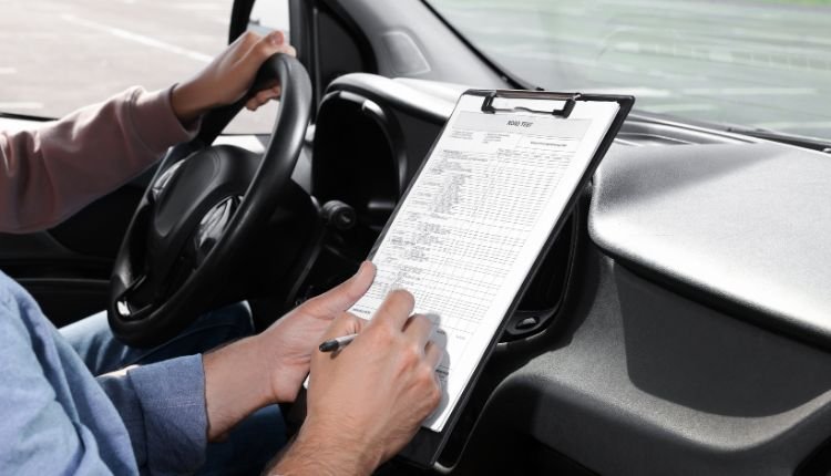 How Long Does It Take to Get a CDL? Driver completing paperwork.