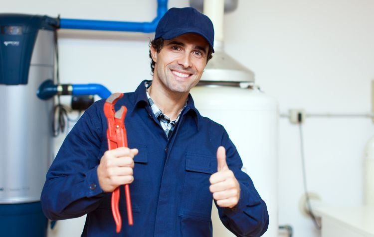 How to Become a Plumber: Skilled tradesman with tools.